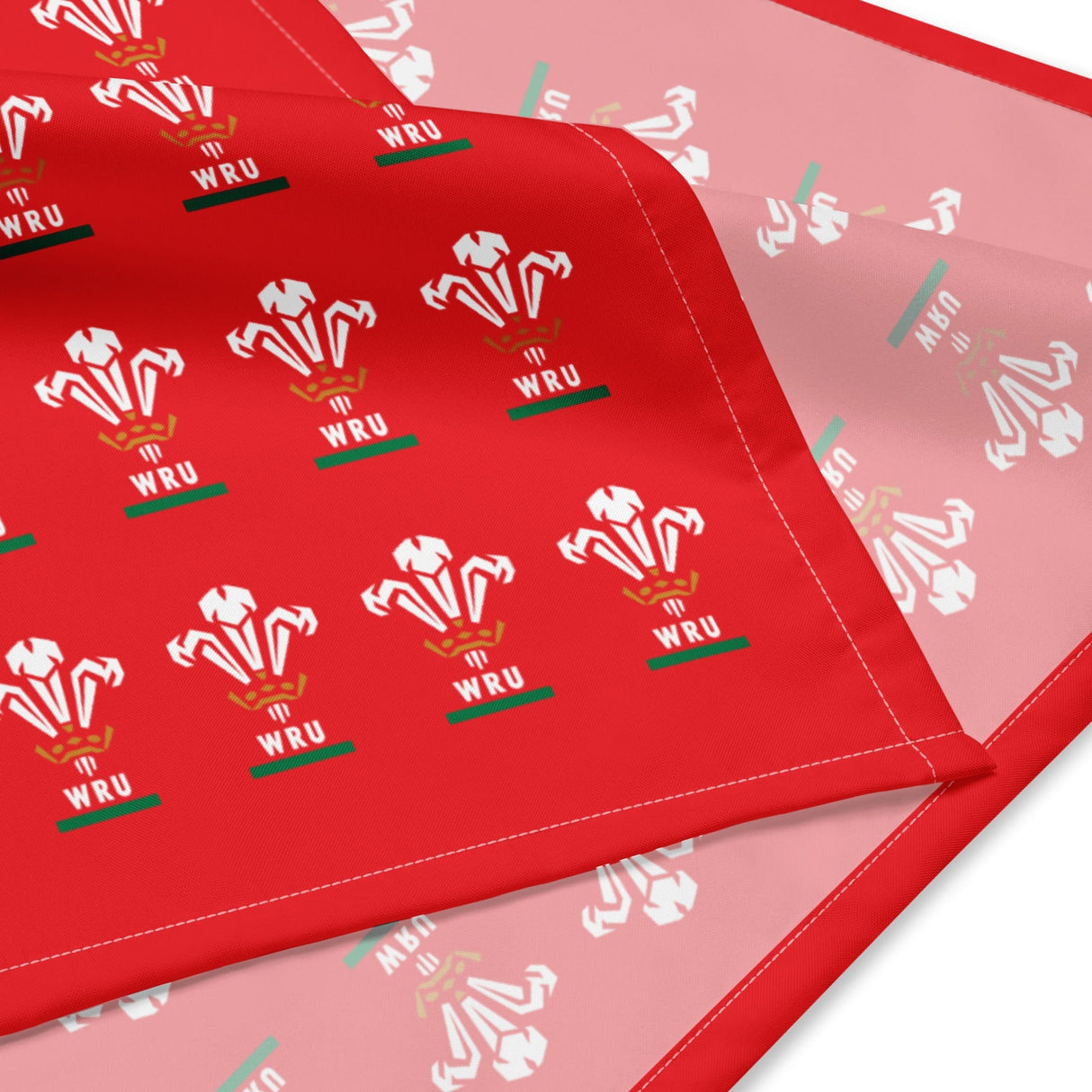Folded Red bandana with a pattern of WRU logos on front and no pattern on back side.