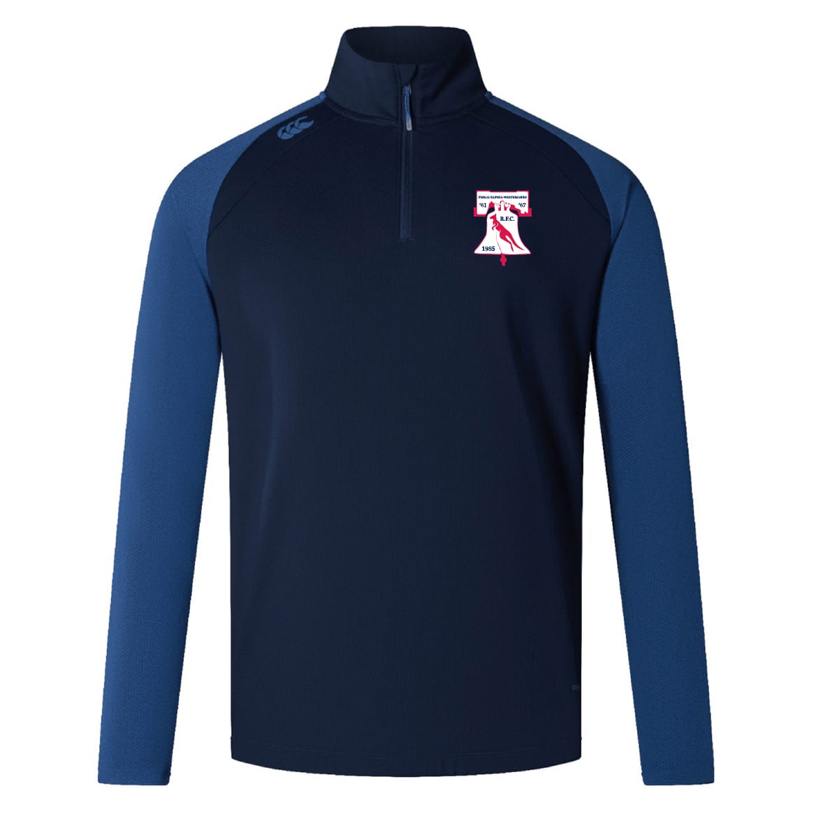 The Philly Whitemarsh RFC Elite First Layer by EMB Canterbury is a navy and royal blue quarter-zip long-sleeve pullover with a red, white, and blue bell-and-eagle logo—ideal for rugby training.