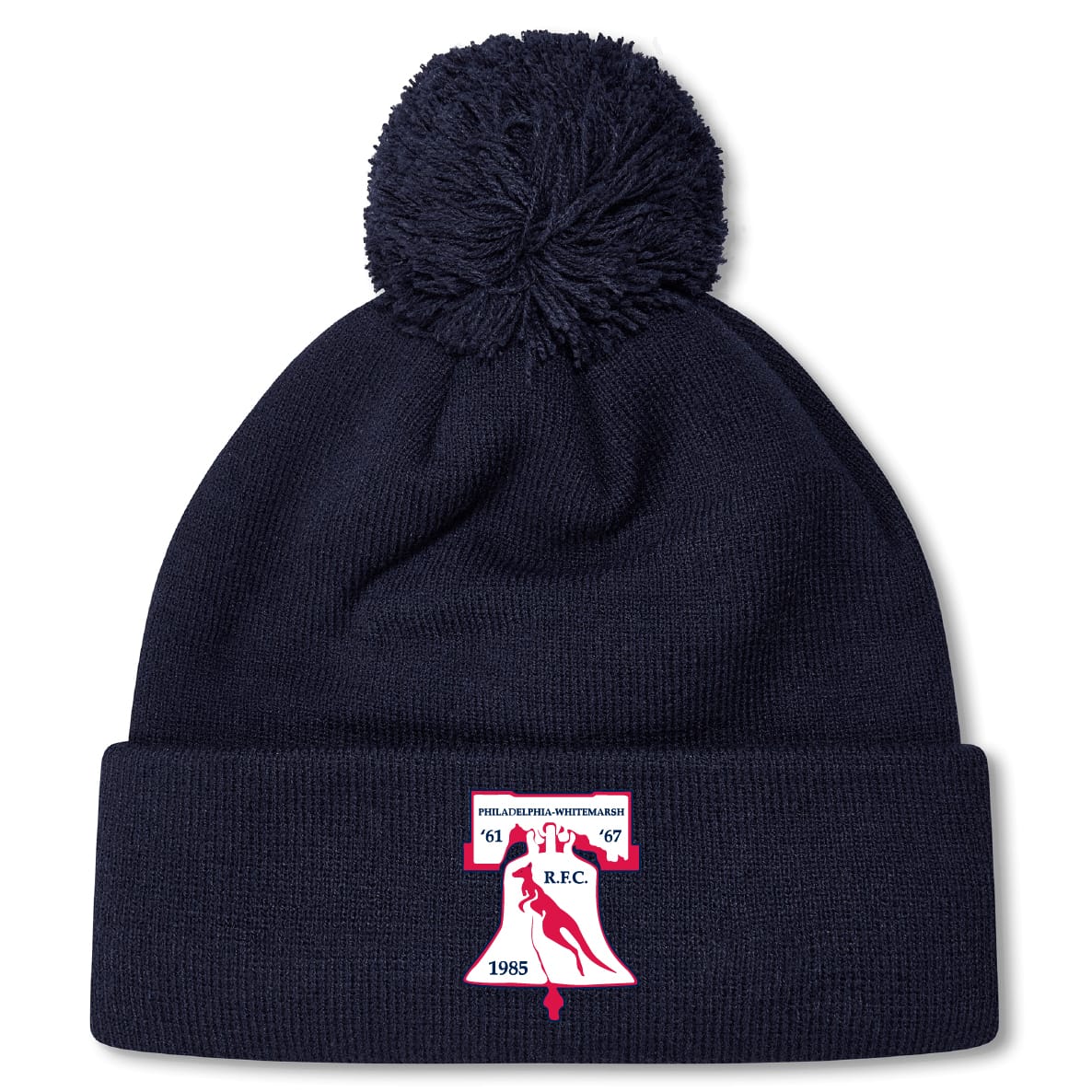 The Philly Whitemarsh RFC Pom Pom Beanie by EMB Canterbury features a navy knit design, fleece lining, pom-pom top, and a front patch with bell, bird, "R.F.C.," and years 1967 & 1985—perfect for chilly days.
