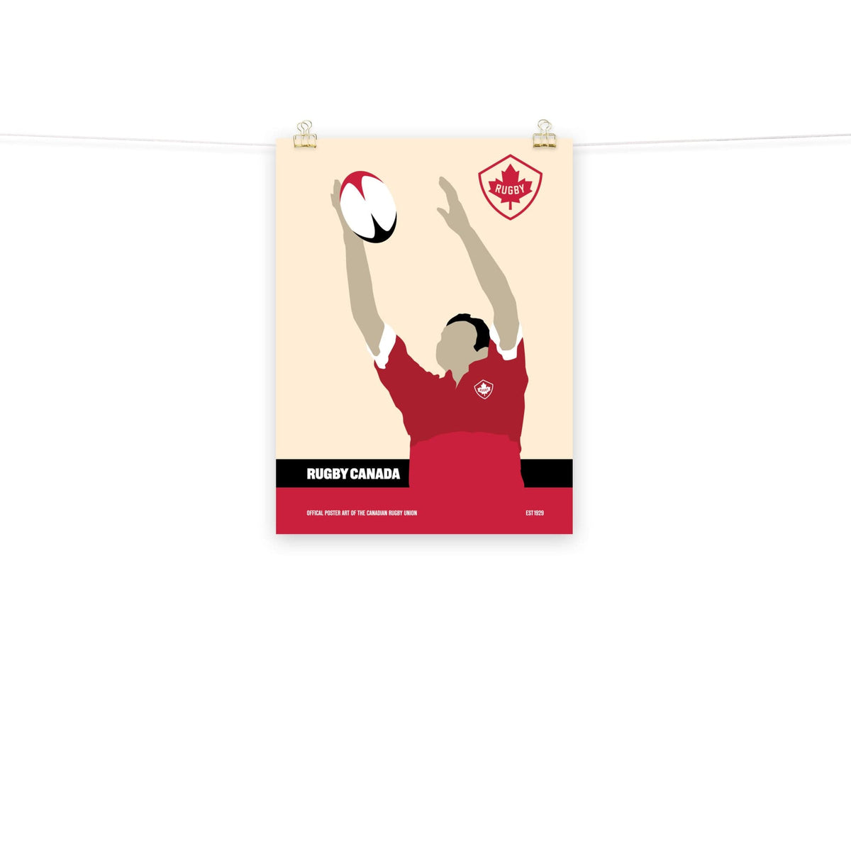 An enthusiastic PF LIC Rugby Canada enthusiast proudly displays a Rugby Canada Rugby Catch Poster on a rope.