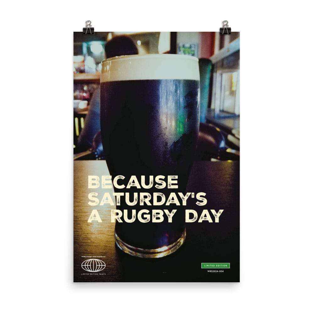 Introducing the PF LIC Rugby Poster 2, featuring an image of a pint of dark beer on a table with the text "Because Saturday's a rugby day" printed over it. This museum-quality piece is crafted on thick matte paper and is sure to brighten any environment.