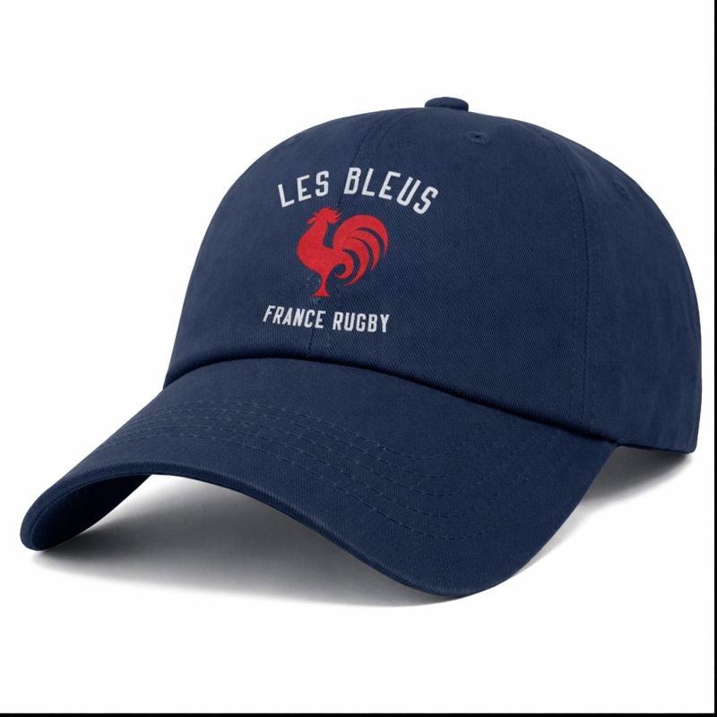 The Les Bleus France Rugby Dad Cap by EMB S&S Activewear is a navy blue cotton twill hat featuring "LES BLEUS FRANCE RUGBY" and a red rooster logo—ideal for any France Rugby fan.