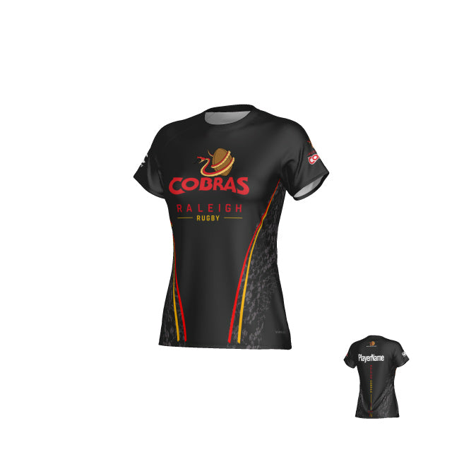 The Raleigh Cobras Canterbury Performance Tee - Womens by Teamatical is a black short-sleeve rugby jersey designed as a moisture-wicking training top. It features “Cobras Raleigh Rugby” and a cobra logo on the front, while the back displays customizable “Player Name” text. This athletic shirt combines style and comfort, making it ideal for women both on and off the field.