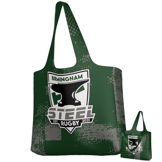 The Teamatical Birmingham Steel DNA Packable Zip Tote is a dark green lightweight bag with a white and gray “Birmingham Steel Rugby Est. 2021” logo featuring a stylized anvil and shield on the front.