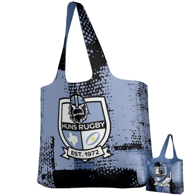 The Teamatical Austin Huns DNA Packable Zip Tote features blue and black performance fabric with a "Huns Rugby Est. 1972" Viking helmet logo, sports icons, and comes in two sizes—ideal for packing your rugby gear.