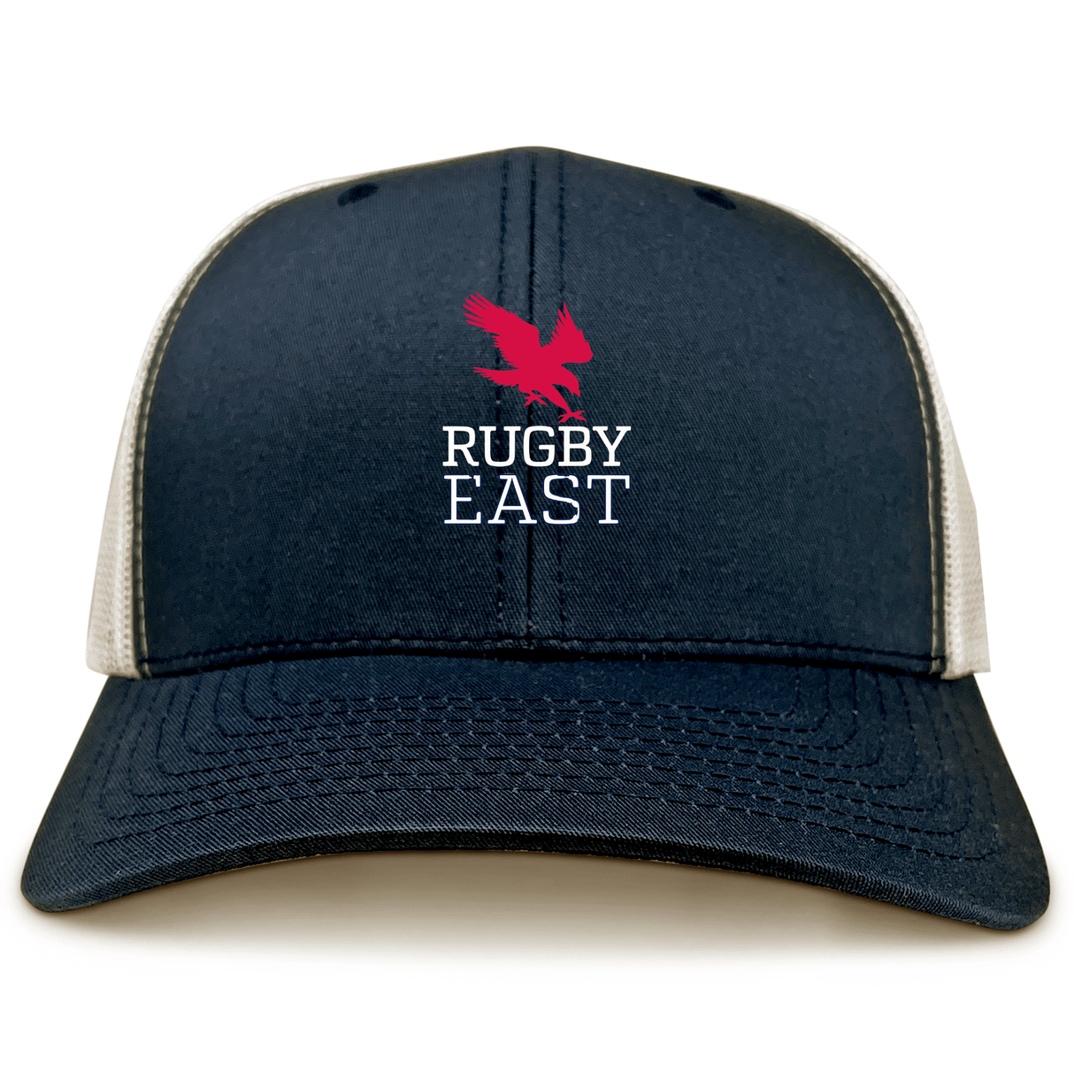 The Rugby East Conference Retro Trucker Cap by EMB S&S Activewear features a dark blue and white design, red eagle graphic, "RUGBY EAST" embroidery on the front, and an adjustable snapback closure.