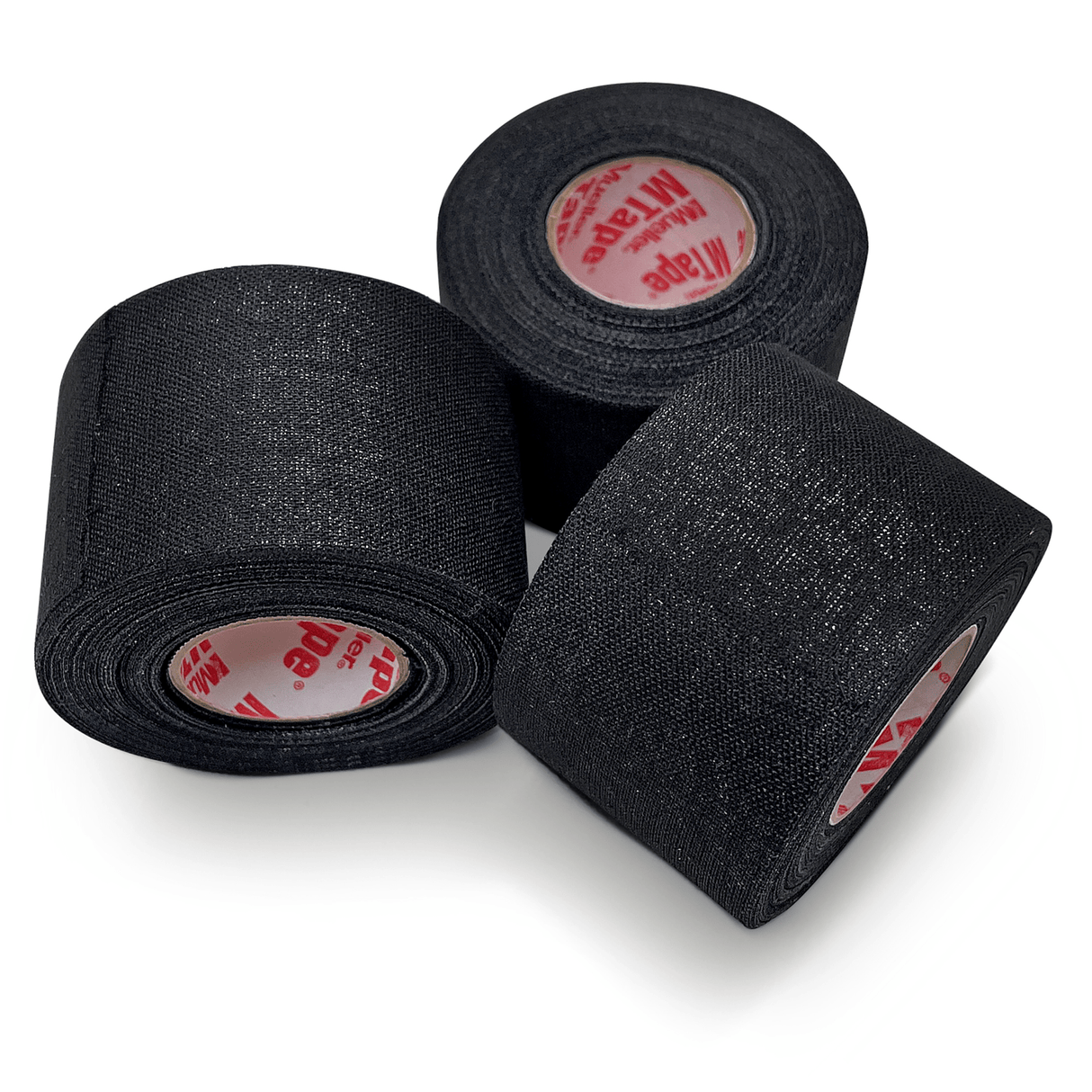 Three rolls from the Mueller Mtape Case-32 Tape Rolls, by Mueller, are arranged with one roll standing upright and two lying on their sides, perfect for any sports medicine needs.