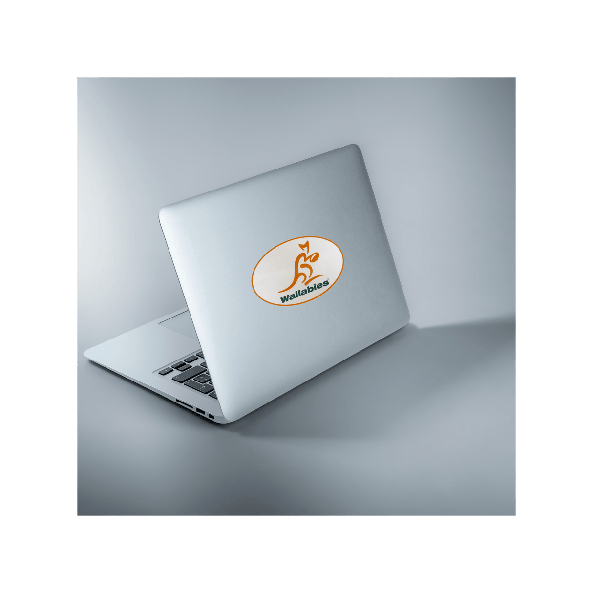 A laptop with a Wallabies Rugby Sticker Sheet - 25 Stickers from World Rugby Shop on it.