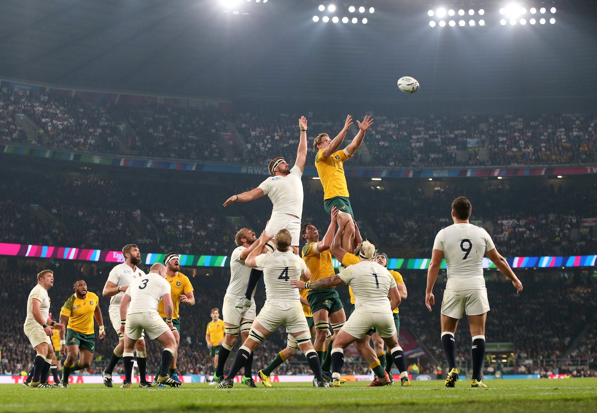 Rugby Player about to kick the ball