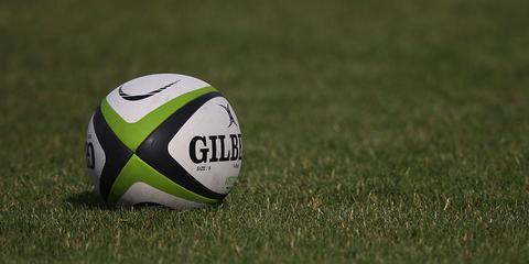 Gilbert rugby ball on pitch