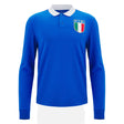 The Italy 25/26 Vintage Long Sleeve Supporters Jersey by Macron features a blue rugby-inspired design, white collar, and an F.I.R. badge with the Italian flag on the left chest.