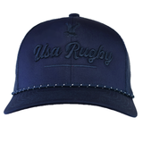 The EMB Augusta USA Rugby Tonal Elevated Eagle Braid Trucker Cap is navy blue with "USA Rugby" and an eagle logo embroidered on the front, plus a dotted pattern accenting the brim for added style.