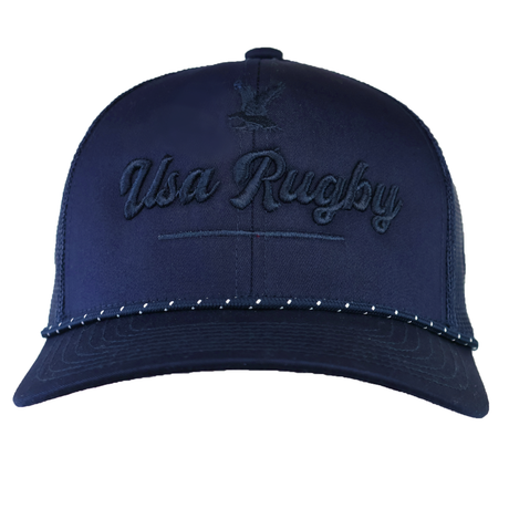 The EMB Augusta USA Rugby Tonal Elevated Eagle Braid Trucker Cap is navy blue with "USA Rugby" and an eagle logo embroidered on the front, plus a dotted pattern accenting the brim for added style.