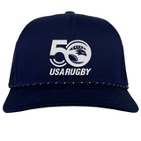 Celebrate USA Rugby's 50th with the EMB Augusta navy blue trucker snapback braid cap, featuring a white "50" logo with stars and a stylized eagle.