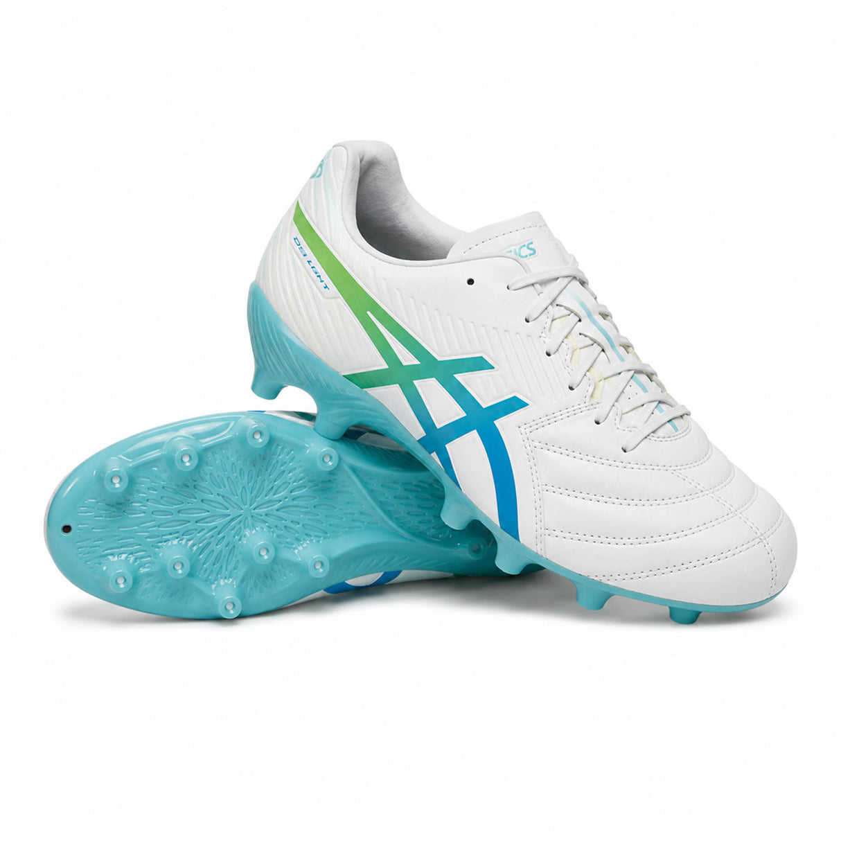 A pair of ASICS Lethal Flash IT FF 3 FG soccer cleats in White/Waterscape, featuring green accents—one shoe upright and the other on its side to display the studded sole. Engineered for lightweight performance, these ASICS cleats combine style and functionality on the field.