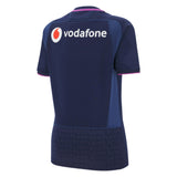 The Women's Scotland 25/26 Replica Home Jersey by Macron features a navy blue design with "vodafone" and its logo across the upper back, plus "SCOTLAND" repeated around the lower hem, inspired by the official Scotland Rugby Women's Jersey.