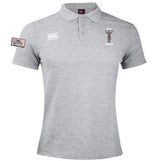 The Dallas Harlequins Lions Origin Waimak Polo by EMB Canterbury is a light grey short-sleeve polo with chest embroidery, a "LIONS" patch on the left sleeve, and made from a comfy cotton-polyester blend.