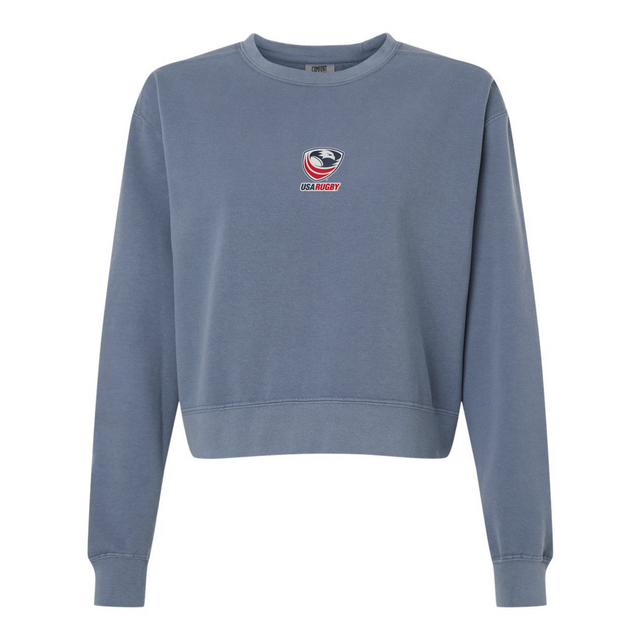 The EMB S&S Activewear Women's USA Rugby Mid-Length Crewneck Sweatshirt is a blue heavyweight fleece, featuring the USA Rugby logo and text centered on the chest for ultimate comfort.
