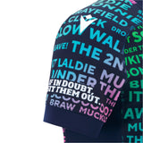 Close-up of the Scotland 25/26 Rainbow Training Jersey by Macron shows its dark sleeve with bold, multicolored text in various fonts and sizes.