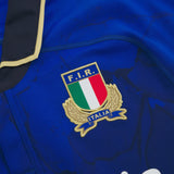 Close-up of the Italian Rugby Federation crest on the blue Italy 25/26 Authentic Home Jersey by Macron.