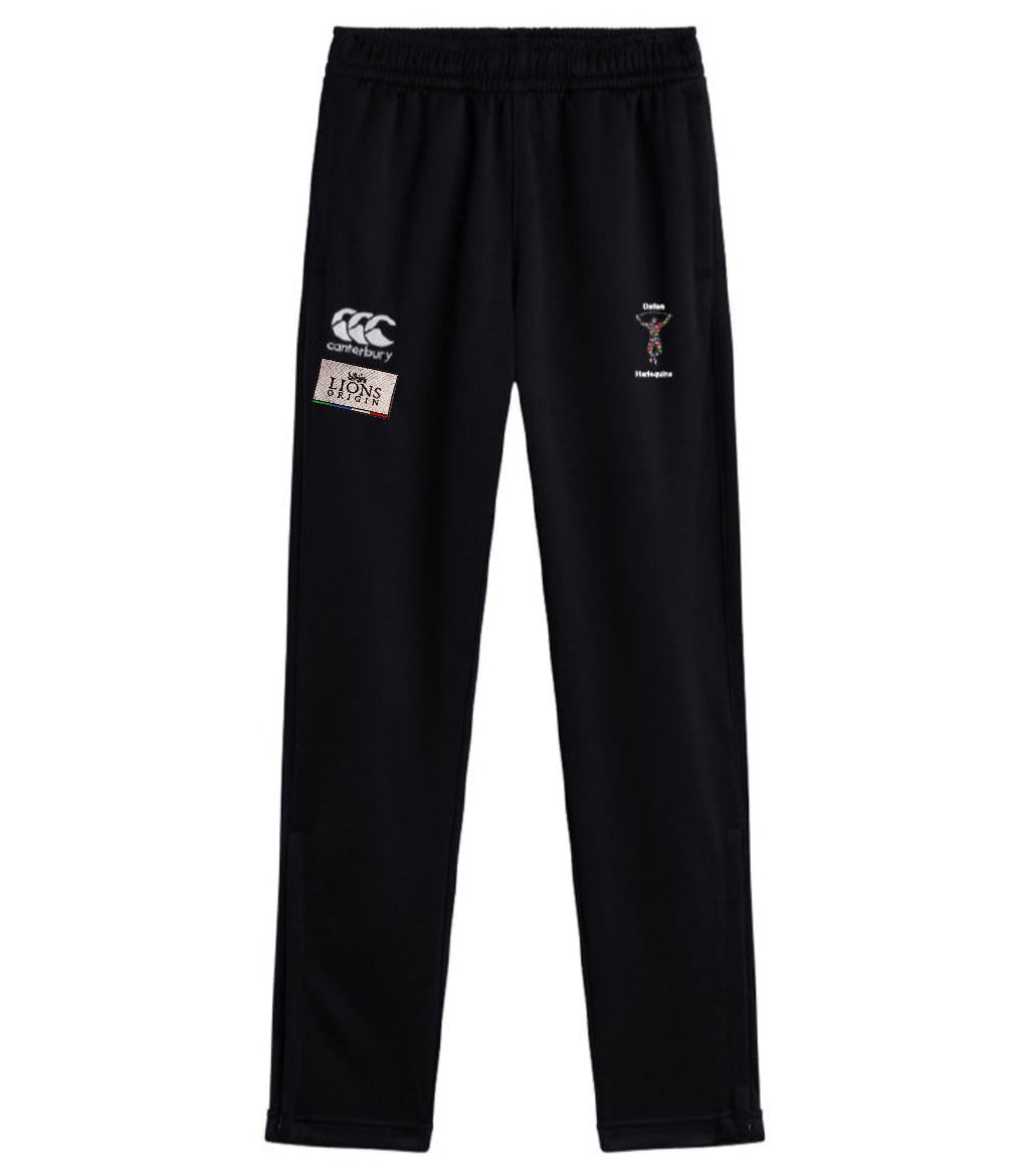 The EMB Canterbury Dallas Harlequins Lions Origin Stretch Tapered Pant features an elastic waistband and multiple embroidered logos on the upper legs for comfort and style, perfect for active days.