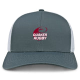 The Guilford College Retro Trucker Cap by EMB S&S Activewear is a gray and white mesh-back hat with an embroidered maroon rugby ball and "Quaker Rugby" on the front, plus a classic snapback closure for adjustable fit.