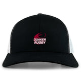 The Guilford College Retro Trucker Cap by EMB S&S Activewear features a black and white design, "Quaker Rugby" and rugby ball logo embroidered in red and white on the front, plus an adjustable snapback closure.