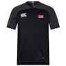 The Guilford College Vapodri Evader Jersey by EMB Canterbury is a black short-sleeve rugby jersey featuring "Canterbury" and "Quaker Rugby" chest logos, a V-neck, subtle paneling, and VapoDri finish for added comfort.
