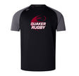 The Guilford College Elite Training Tee by WRS Canterbury is a black and gray short-sleeve tee with "QUAKER RUGBY" and a rugby ball logo, made with Vapodri fabric for lightweight durability—ideal for athletic performance.