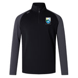 The EMB Canterbury Las Colinas Rugby Elite First Layer is a black and gray quarter-zip pullover with a crest logo on the left chest, brand logo on the right shoulder, and VapoDri tech—perfect for rugby training.