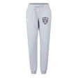 The Franklin County High School Rugby Women's Leisure Sweatpant by EMB Canterbury features a light gray organic cotton build, drawstring waist, tapered legs, and a shield logo—ideal everyday comfort from Canterbury.