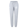 The Fortivus Academy Women's Leisure Sweatpant by EMB Canterbury features a light gray hue, drawstring waist, elastic cuffs, and logo on the thigh. Made from soft organic cotton for everyday comfort.