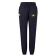 The Monarch Rugby Club Women's Leisure Sweatpant by EMB Canterbury features a navy blue design, drawstring waist, white Canterbury logo on the left thigh, and a circular yellow and black crest on the right thigh.
