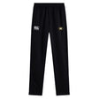 The Monarch Rugby Club Stretch Tapered Pant by EMB Canterbury features an elastic waistband, quick-dry fabric, a white Canterbury logo on the left, and a yellow-black oval emblem—ideal men's workout pants for any activity.