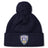 Stay warm in the EMB Canterbury Franklin County High School Rugby Pom Pom Beanie by Canterbury, featuring a navy blue knit, cozy fleece lining, and a "Flyer RFC" shield logo patch on the front cuff.