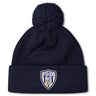 Stay warm in the EMB Canterbury Franklin County High School Rugby Pom Pom Beanie by Canterbury, featuring a navy blue knit, cozy fleece lining, and a "Flyer RFC" shield logo patch on the front cuff.