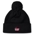 Stay warm in the Guilford College Pom Pom Beanie by EMB Canterbury, featuring a black knit design with fleeced lining, a top pom-pom, and "Quaker Rugby" logo in red and white on the front cuff.