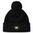 The Monarch Rugby Club Pom Pom Beanie by EMB Canterbury is a black, fleece-lined hat with a pom-pom and an embroidered gold "M" Monarch Rugby logo on the front cuff.