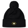 The Monarch Rugby Club Pom Pom Beanie by EMB Canterbury is a black, fleece-lined hat with a pom-pom and an embroidered gold "M" Monarch Rugby logo on the front cuff.