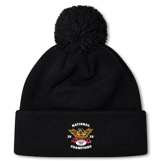 Stay warm in the Atlanta Old White Rugby Champs Pom Pom Beanie by EMB Canterbury, featuring a "National Champions 2025 OWU" logo, eagle design, cozy fleece lining, and classic pom-pom—perfect for rugby fans.
