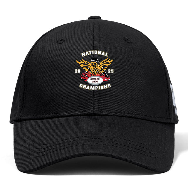 The Atlanta Old White Rugby Champs Flexfit Drill Cap by EMB Canterbury features a gold eagle emblem, red ribbon, CCC logo, and “National Champions 2025”/“Owls WC” text.