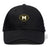 The Monarch Rugby Club Flexfit Drill Cap by EMB Canterbury features a gold and white "Monarch Rugby" embroidered logo with a large "M" inside a rugby ball shape on the front.