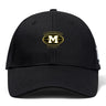 The Monarch Rugby Club Flexfit Drill Cap by EMB Canterbury features a gold and white "Monarch Rugby" embroidered logo with a large "M" inside a rugby ball shape on the front.