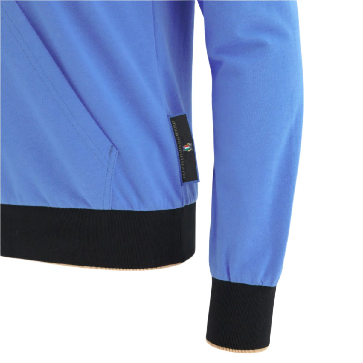 A close-up of the blue Italy 25/26 Fleece Supporters Hoodie by Macron, featuring long sleeves, a black waistband and cuff, and a small black tag on the side seam.