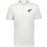 The EMB Augusta Nations of Rugby New Zealand Vintage Polo is a white cotton polo with a black fern leaf and "1884" on the left chest, inspired by classic rugby shirts.
