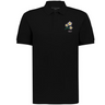 The EMB Augusta Nations of Rugby Japan Vintage Polo is a black cotton rugby shirt with a small cluster of white and yellow flowers and "1932" on the left chest, inspired by classic rugby designs.