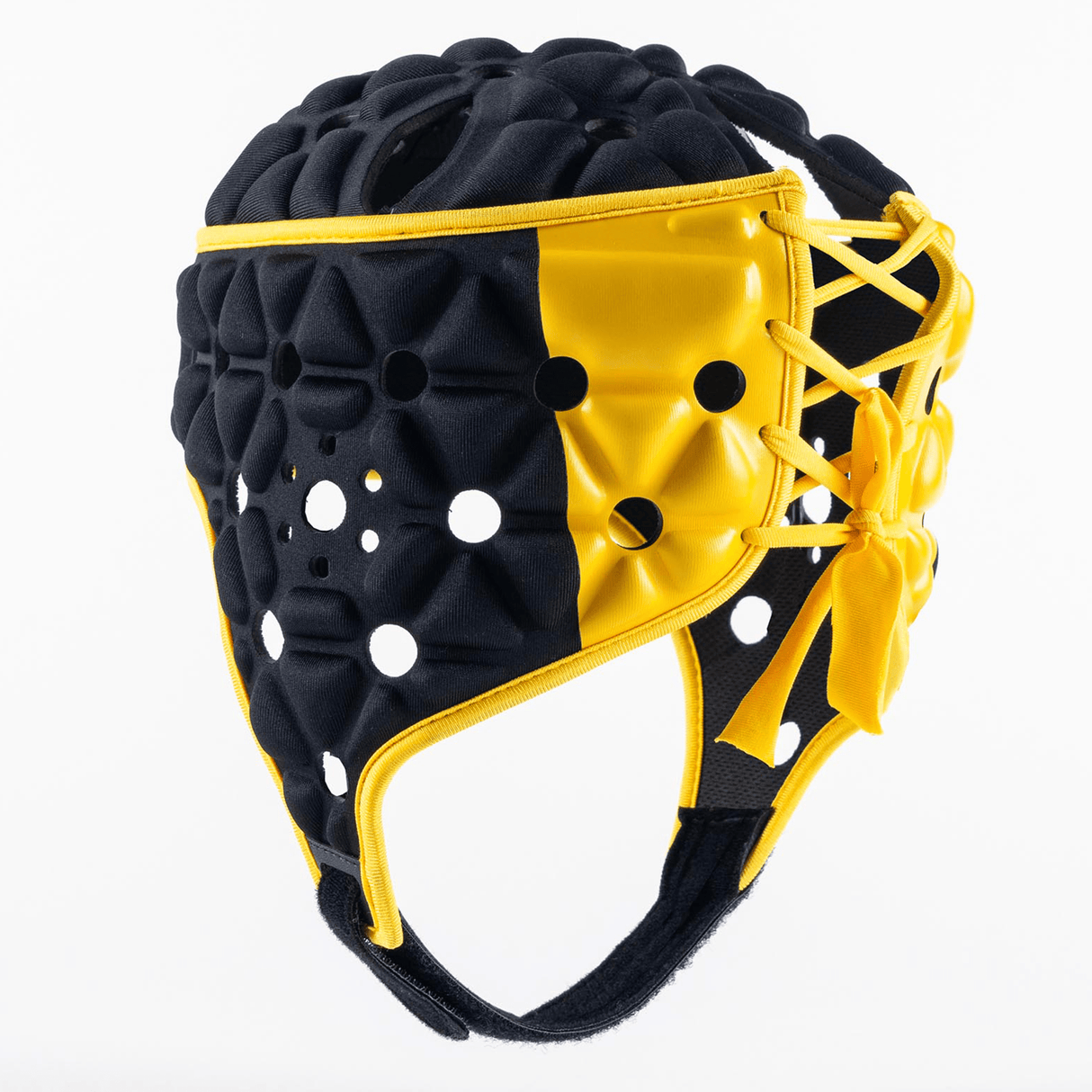 The Gilbert Limited Edition Air Headguard is a black and yellow padded sports helmet adorned with geometric patterns and ventilation holes. Featuring laces on the side for a secure fit, this headgear provides excellent shock absorption. Ideal for rugby, it ensures both style and safety on the field.