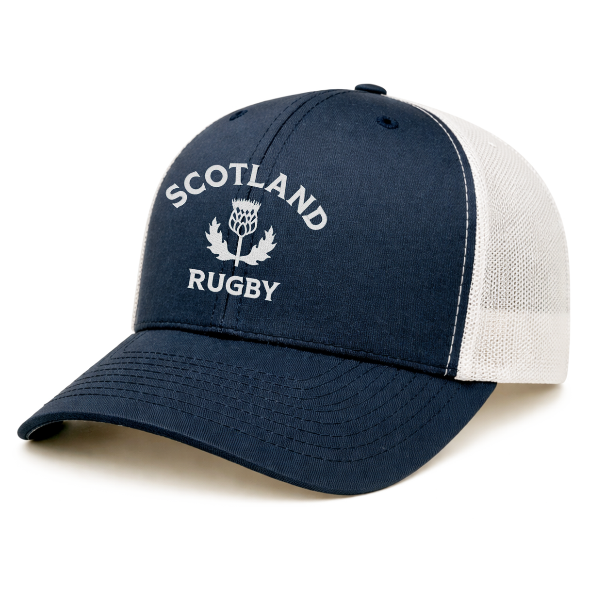 The EMB S&S Activewear Nations of Rugby Scotland Retro Trucker Cap features navy blue and white mesh panels, a snapback fit, and "Scotland Rugby" with a thistle emblem—perfect for rugby fans.