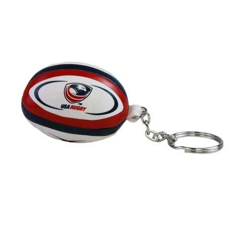 The USA Rugby Ball Keyring by Gilbert is a small red, white, and blue rugby ball keyring featuring the USA Rugby logo, designed by Gilbert.