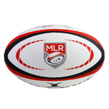 The Gilbert MLR Match Ball is a white rugby ball with red and black accents, featuring the Major League Rugby logo at its center—a replica of the official MLR match ball.